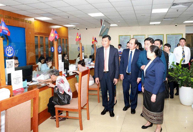 Hà Nội chia sẻ kinh nghiệm quản trị chính quyền địa phương 2 cấp với Lào- Ảnh 3.